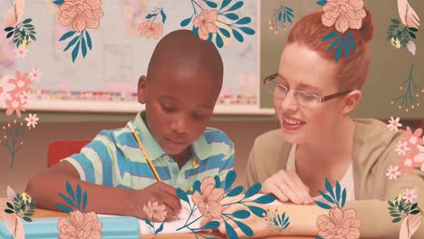 Animation-of-flower-icons-over-smiling-caucasian-female-teacher-teaching-african-american-schoolboy