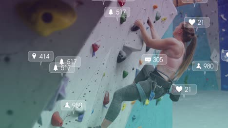 Animation-of-media-icons-over-caucasian-woman-on-climbing-wall