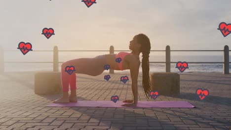 Animation-of-heart-icons-over-biracial-woman-exercising-on-promenade