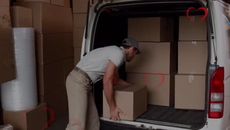 Animation-of-heart-icons-over-smiling-caucasian-male-deliverer-packing-car