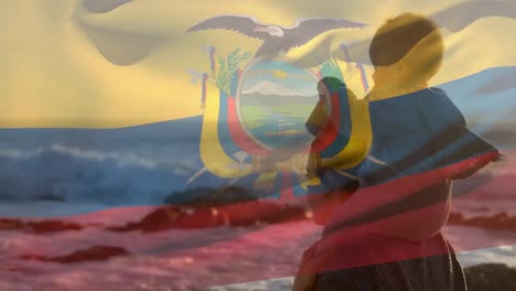 Animation-of-flag-of-ecuador-over-caucasian-mother-with-child-at-beach