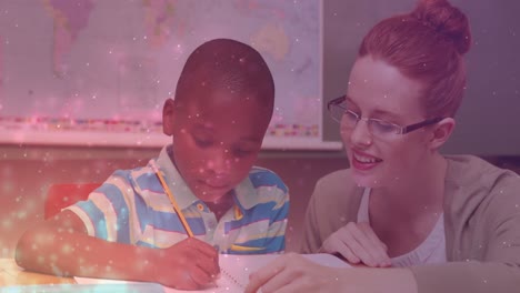 Animation-of-light-spots-over-caucasian-female-teacher-with-african-american-schoolboy-learning