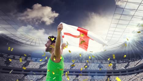 Animation-of-confetti-floating-over-caucasian-man-holding-english-flag-at-stadium