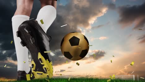 Animation-of-confetti-over-feet-of-caucasian-soccer-player-and-gold-ball-at-sunset