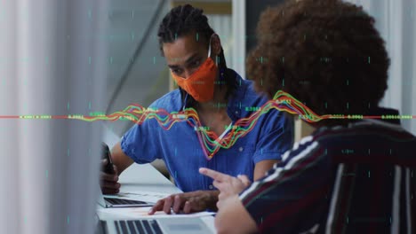 Animation-of-data-processing-over-diverse-business-people-with-face-masks-using-laptops