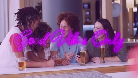 Animation-of-good-vibes-only-text-over-happy-diverse-friends-talking-and-drinking-beer