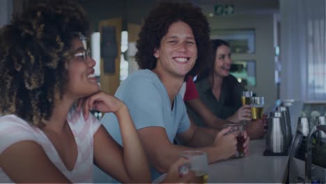 Animation-of-happy-diverse-friends-drinking-beer