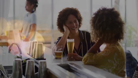 Animation-of-light-spots-over-happy-diverse-friends-drinking-beer
