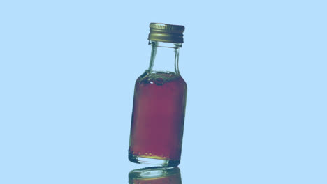 Animation-of-molecules-over-rotating-bottle-with-red-liquid