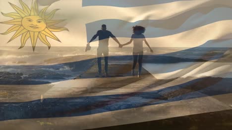 Animation-of-flag-of-uruguay-over-african-american-couple-at-beach