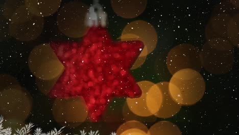 Snow-falling-over-hanging-star-against-spots-of-light-against-red-background-with-copy-space