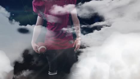 Animation-Von-Wolken-über-Einem-Kaukasischen-Männlichen-American-Football-Spieler-Mit-Ball