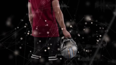 Animation-of-data-processing-over-caucasian-male-american-football-player-with-ball