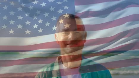 Animation-of-flag-of-united-states-of-america-over-happy-senior-caucasian-man-on-beach