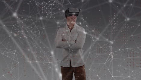 Animation-of-network-of-connections-with-glowing-spots-over-caucasian-man-wearing-vr-headset
