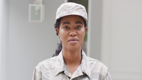 Animation-of-african-american-female-soldier-looking-at-camera
