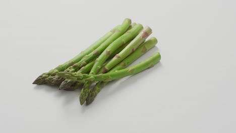 Video-of-fresh-asparagus-with-copy-space-over-white-background