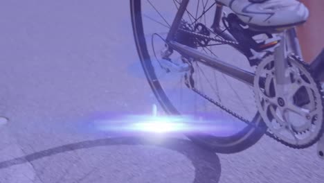 Animation-of-light-spots-over-caucasian-woman-cycling