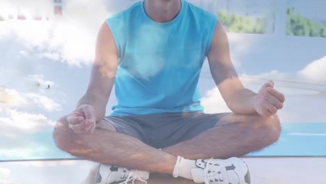 Animation-of-clouds-over-caucasian-man-practicing-yoga-and-meditating