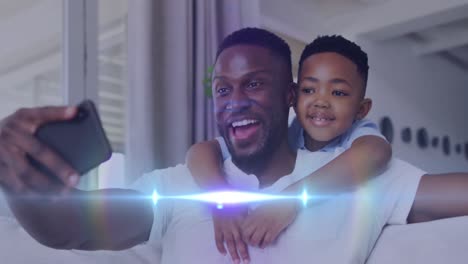 Animation-Von-Lichtern-über-Einem-Glücklichen-Afroamerikanischen-Vater-Und-Sohn,-Die-Ein-Selfie-Machen