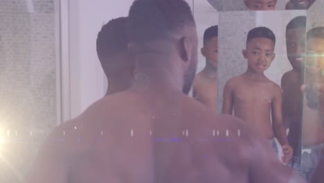 Animation-of-lights-over-happy-african-american-father-and-son-looking-at-mirror-in-bathroom