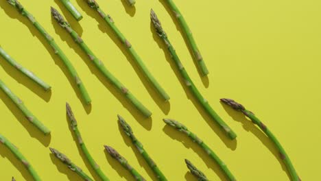 Video-of-c-fresh-asparagus-stalks-over-green-background
