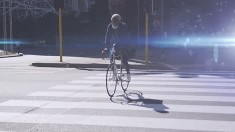 Animation-Von-Lichtflecken-über-Einem-Afroamerikanischen-Mann-Beim-Radfahren