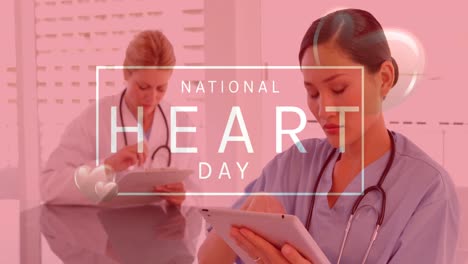 Animation-of-national-heart-day-text-over-diverse-female-doctor-and-nurse-using-tablets