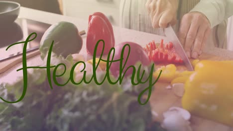 Animation-of-healthy-text-in-green-letters-over-caucasian-woman-cutting-vegetables