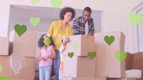 Animation-of-heart-icons-over-happy-african-american-family-moving-house