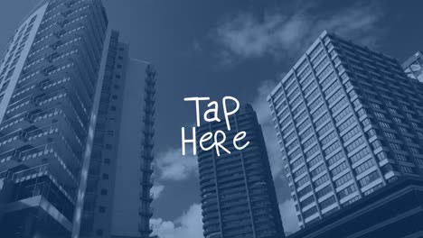 Animation-of-tap-here-text-with-lines-over-modern-cityscape