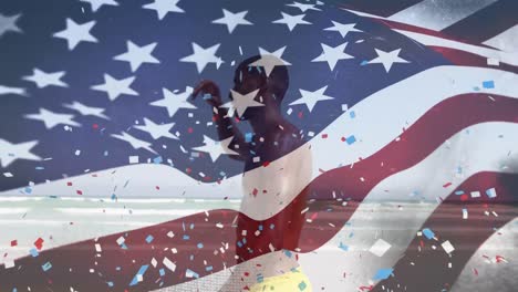 Animation-of-american-flag-and-confetti-over-african-american-man-at-beach