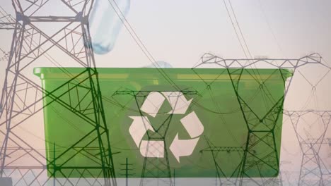 Animation-of-green-recycling-sign-over-box-with-plastic-bottles-and-electric-pylons