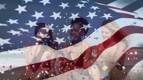 Animation-of-american-flag-and-confetti-over-diverse-female-friends-at-beach