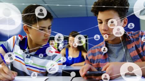 Animation-of-network-of-connections-with-icons-over-diverse-students-using-smartphone-in-classroom