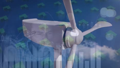 Animation-Von-Grafiken,-Formen-Und-Einer-Sich-Bewegenden-Windkraftanlage-über-Einem-Kaukasischen-Mann,-Der-Im-Büro-Arbeitet