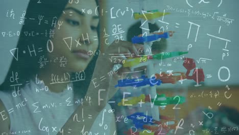 Animation-of-mathematical-equations-over-biracial-female-student-with-models-in-classroom