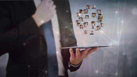 Animation-of-globe-of-connections-with-people's-photos-over-caucasian-businessman-using-tablet
