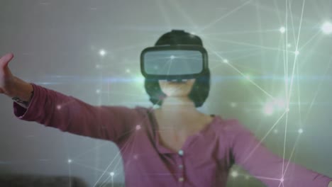 Animation-of-network-of-connections-over-caucasian-woman-wearing-vr-headset