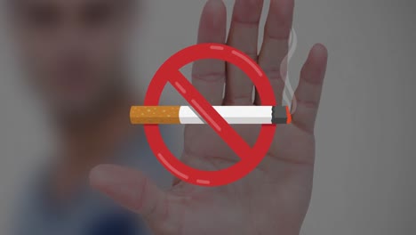 Animation-of-no-smoking-sign-with-cigarette-over-caucasian-man's-hand