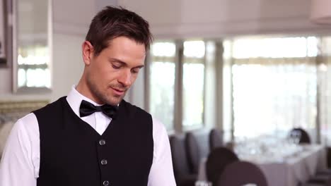 Handsome-waiter-taking-an-order