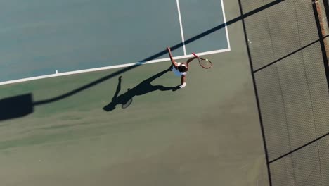 Video-of-top-view-of-african-american-female-tennis-player-on-court