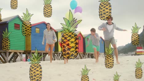 Animation-of-pineapple-icons-over-happy-caucasian-family-running-at-beach