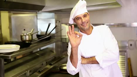 Handsome-chef-making-ok-sign-to-camera