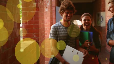 Animation-of-yellow-circles-floating-over-caucasian-female-and-male-teenagers-on-school-corridor