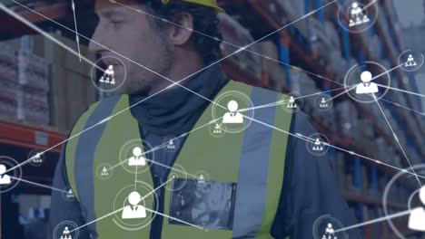 Animation-of-network-of-connections-with-icons-over-smiling-diverse-workers-in-warehouse