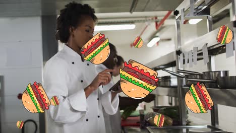 Animación-De-íconos-De-Hamburguesas-Sobre-Chefs-Afroamericanos-Masculinos-Y-Femeninos-En-La-Cocina