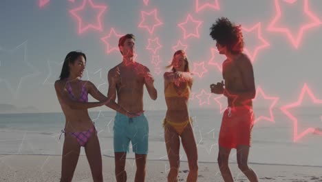 Animation-of-neon-stars-changing-colours-over-happy-diverse-friends-dancing-on-beach