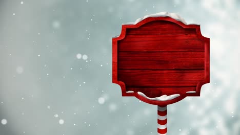 Animation-of-snow-over-red-tag-with-copy-space-on-grey-background