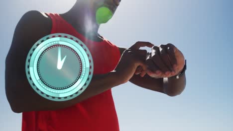 Animation-of-clock-over-african-american-man-training-in-sun-using-smartwatch
